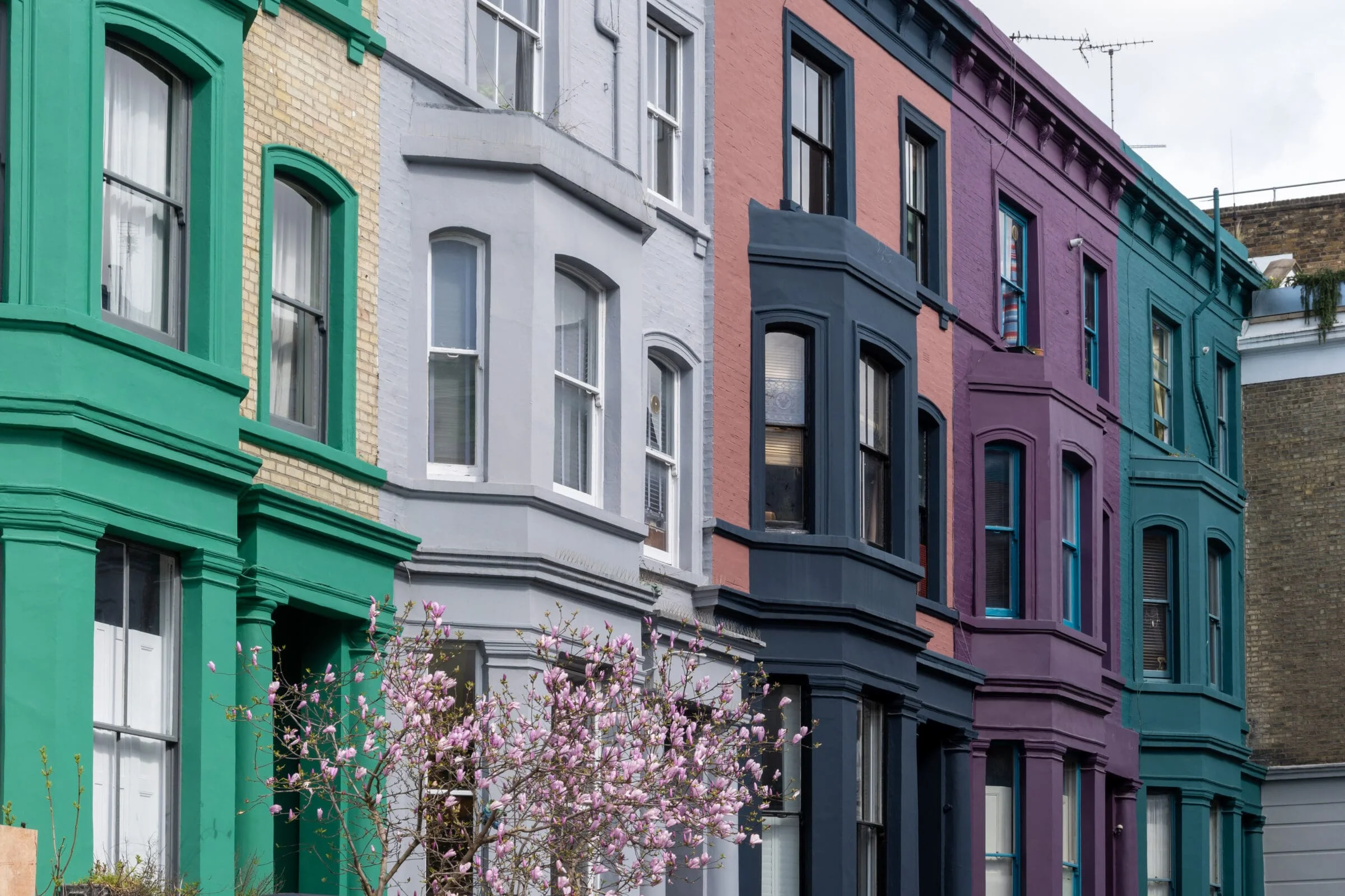 Touristic route on Notting Hill, walking on streets with colourful houses, Portobello road, city life, wealthy neighbourhoods in London, UK in spring. Private Client Law Services in London, Notting Hill and Clapham.